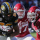 Missouri wide receiver Tauski Dove tries to shake free from Hayden Henry and Montaric Brown against Arkansas in a 2021 loss.